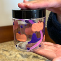 Halloween jar with pumpkins and witch hats