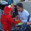 CFDSO member with a trick-or-treater in Elmo costume
