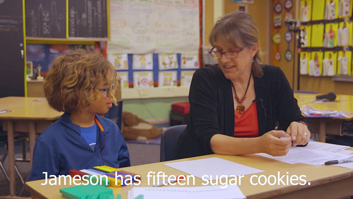 Dr. Lisa Lamb works with a student on some math problems.