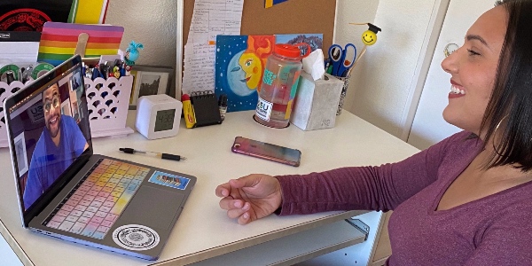 Community-Based Block graduate student Lucy Plascencia (right) speaks to fellow CBB graduate student Nathan Klein via teleconferencing.