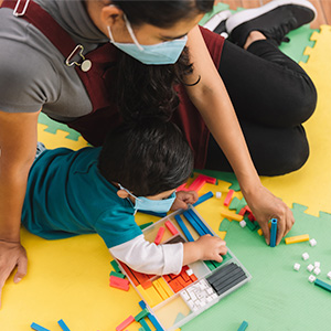 Woman playing with boy.