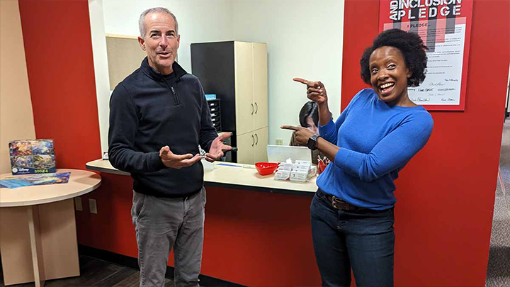 Paul Justice and Adrienne Nicodemus in the OSS office.