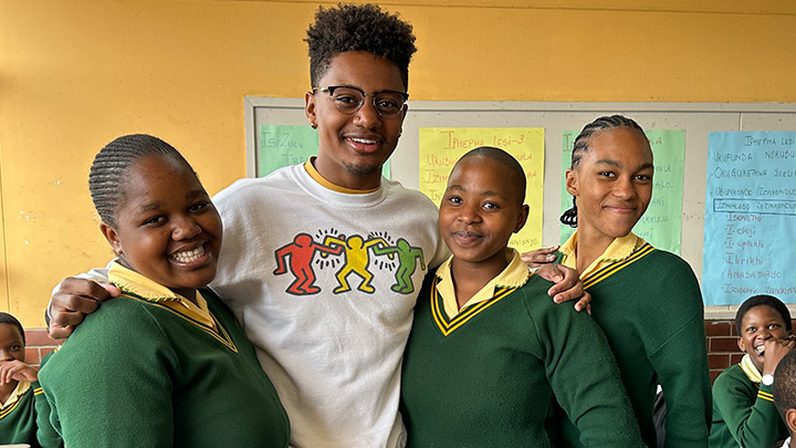 Wesley Cox with students in South Africa.