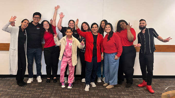 Rosie Villafana-Hatcher (far left), Wendy Ochoa (third from left) and the It Takes a Village team pose as a group.