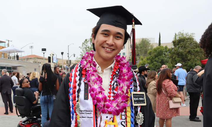 Renz Mark Cabrera poses in his graduation attire